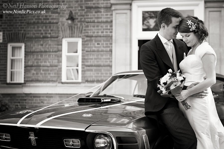 Bride and Groom and the Mustang Wedding Car outside St Hughs College Oxford