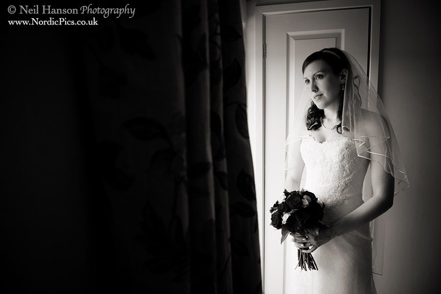 Bride portrait on her Wedding day at Caswell House in Oxfordshire by Photographer Neil Hanson