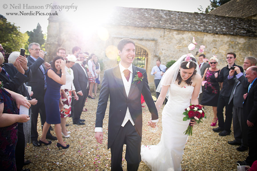 Confetti being thrown at a wedding at caswell house in oxfordshire