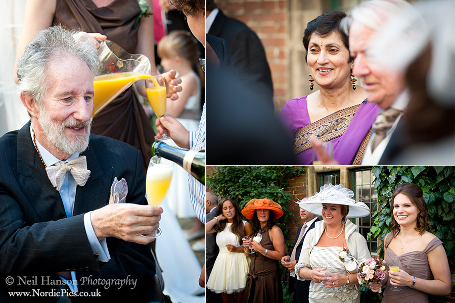 Guests enjoying a sunny drinks reception in the grounds of St Peters College Oxford