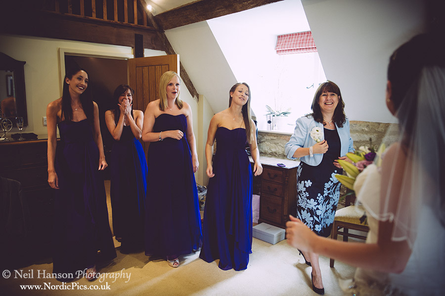 Bridesmaids see the bride for the first time at Caswell House