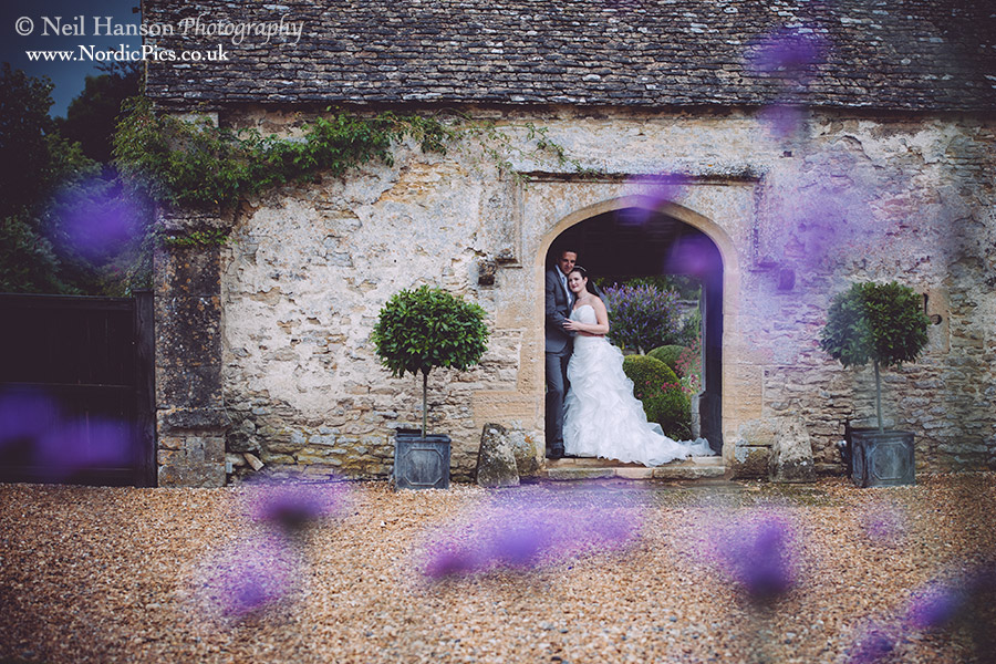 Bride & groom in the beautiful gardens of Caswell House in oxfordshire