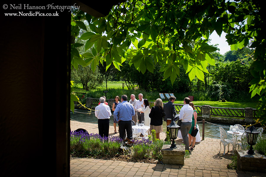Drinks reception on the terrace by the river at the Old Swan and Minster Mill