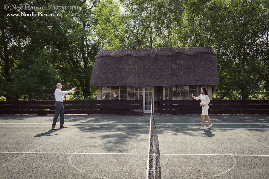 Bride & Groom playing Tennis on their Wedding day at The Old Swan and Minster Mill