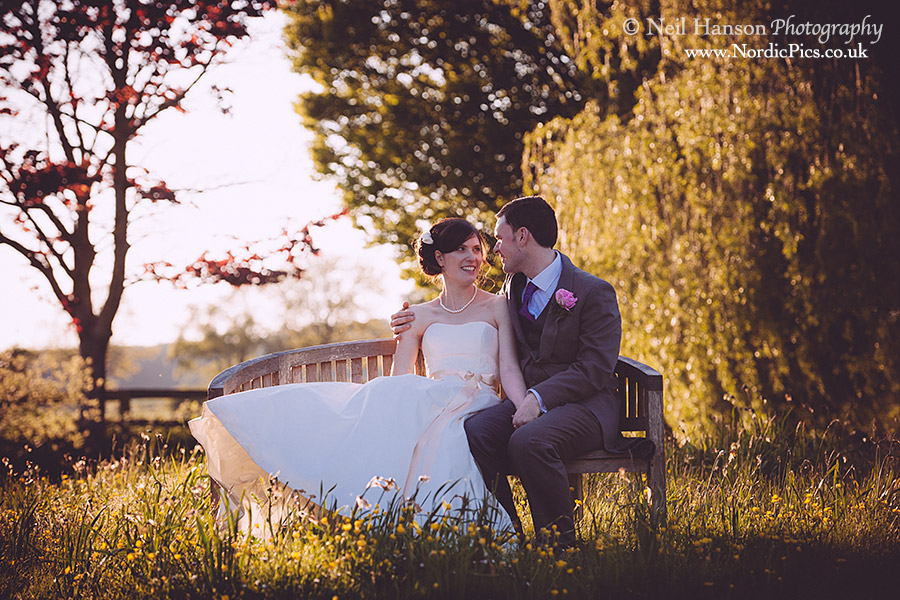 Bride & groom at sunset at their Wedding in the Cotswolds at Caswell House