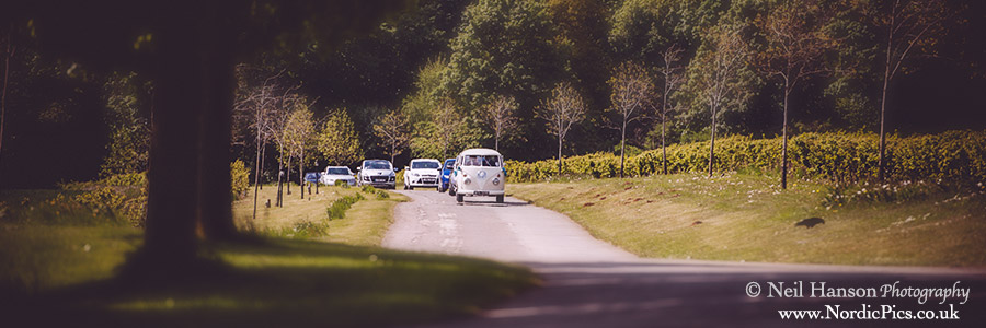 VW Camper Van procession arriving at The Great Barn in Aynho