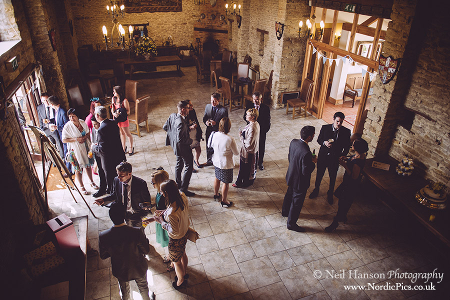 Guests inside the rustic Great Barn in Oxfordshire