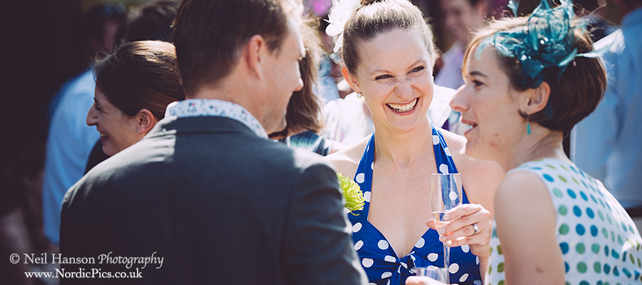Guests laughing during drinks reception at Rye Hill Golf Club Wedding