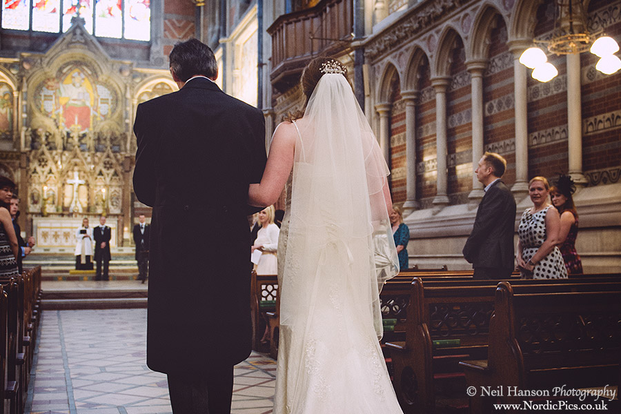 Bride walks down the aisle at Keble College Chapel in Oxford