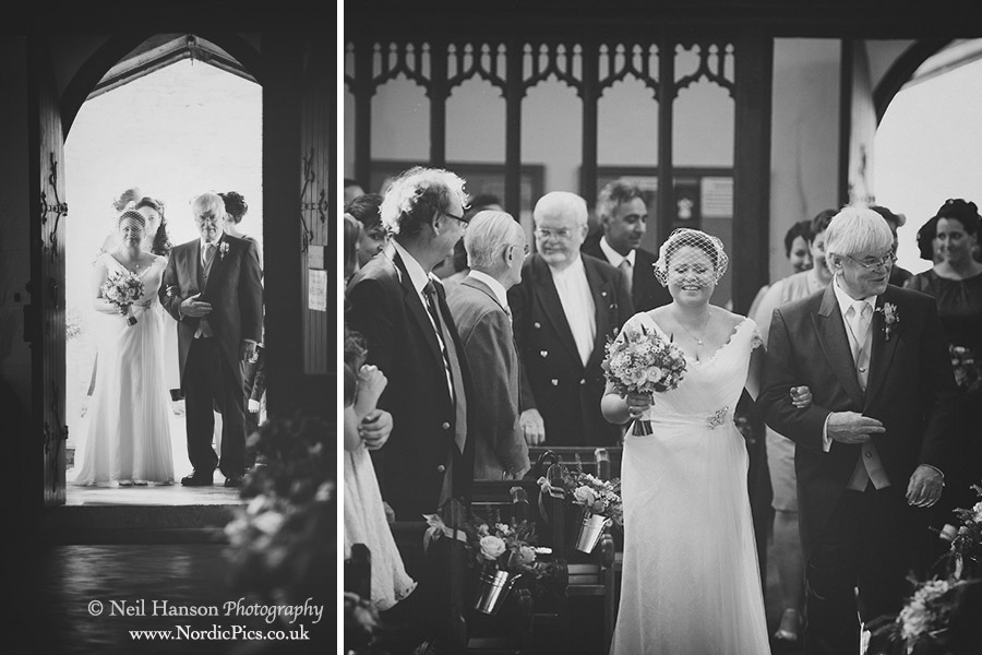 Bride walks down the isle with her father on her Wedding day at St Marys Church Woodstock