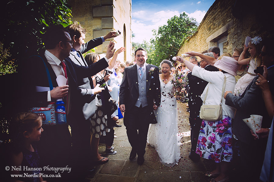 Wedding Confetti being thrown at St Marys Church Woodstock Oxfordshire