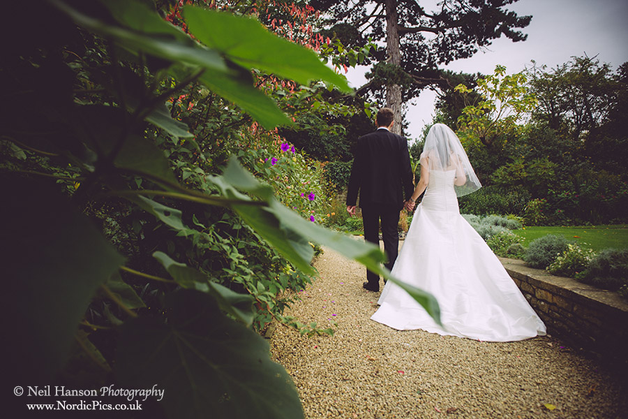 Bride and Groom in the gardens of Rhodes House on their Wedding day in Oxford
