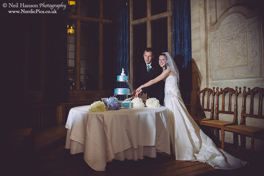 Bride and Groom cut their cake at Rhodes House in Oxford