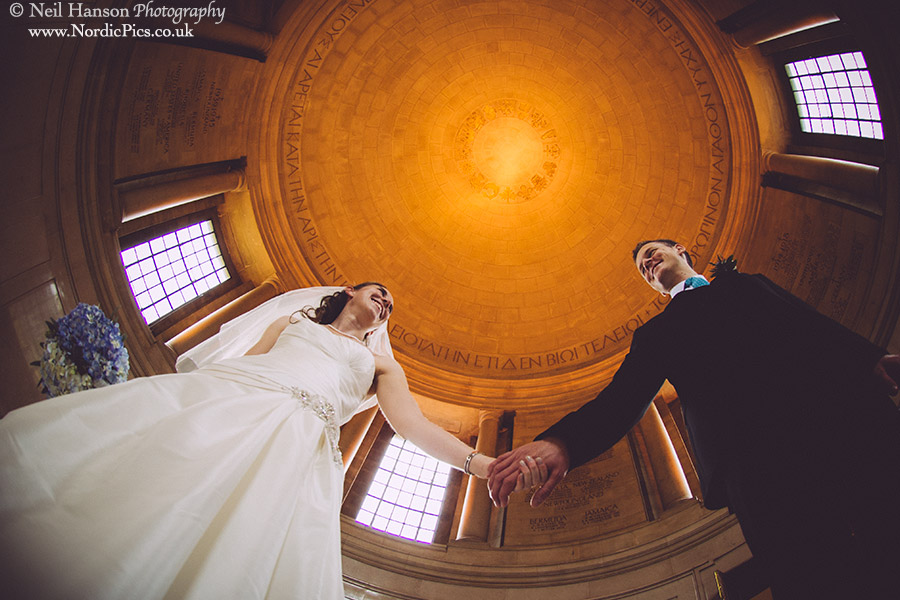 Bride and Groom in the Rotunda on their Wedding day at Rhodes House Oxford