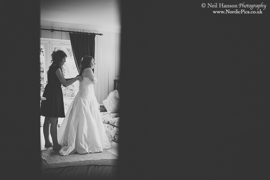 Bride putting her dress on