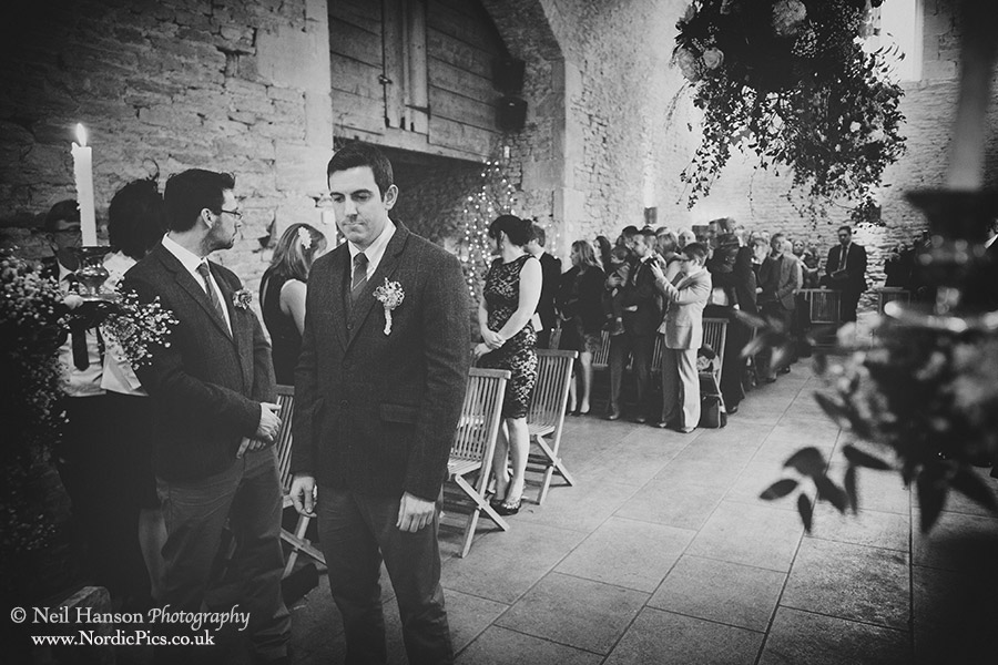 Grooms waits for the bride at Cripps Stone Barn