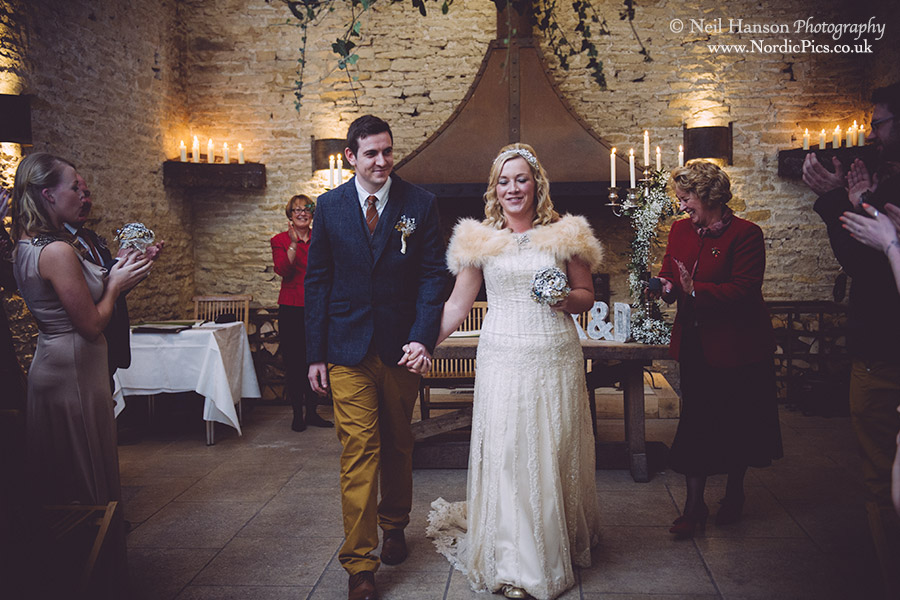 Bride and Groom exit their Wedding ceremony at Cripps Stone Barn
