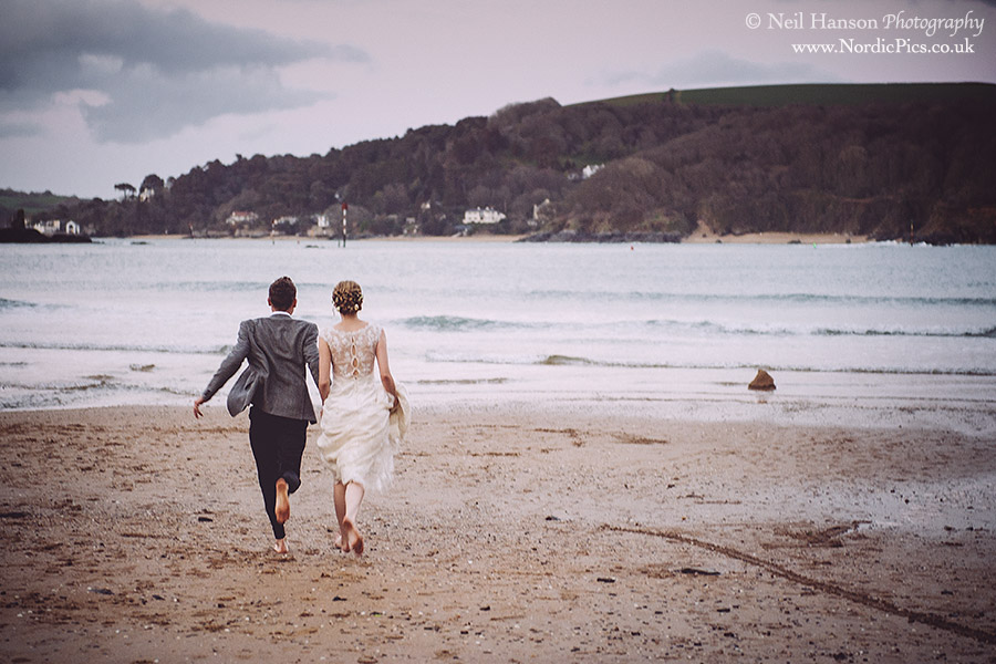 Bride and Groom at the beach on their Wedding day in Salcombe