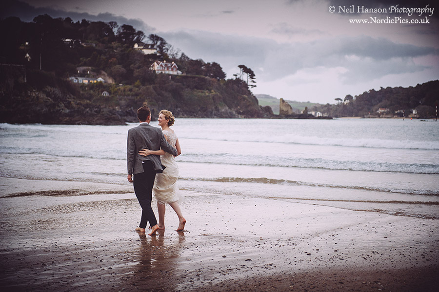 Bride & Groom at the beach on their Wedding day at Salcombe Harbour Hotel