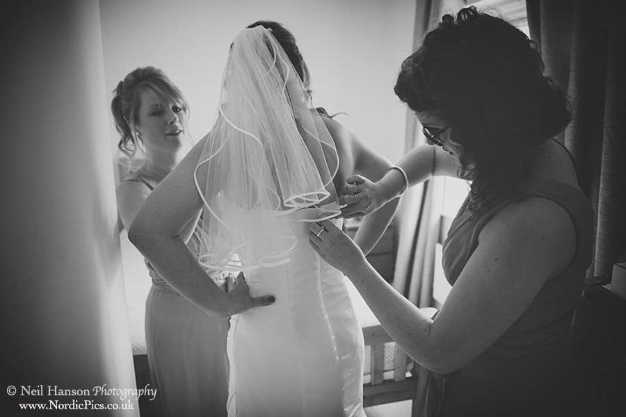 Brides getting into her Wedding dress