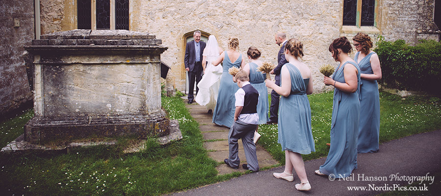 Bride & Bridesmaids enter St Marys Church Cogges for a Wedding