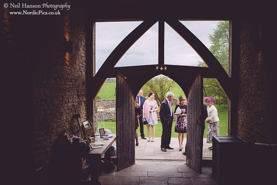 Guests arriving for a Wedding Ceremony at Cripps Barn in Gloucestershire