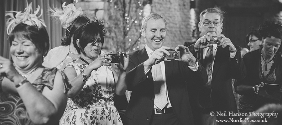 Wedding guests taking photographs