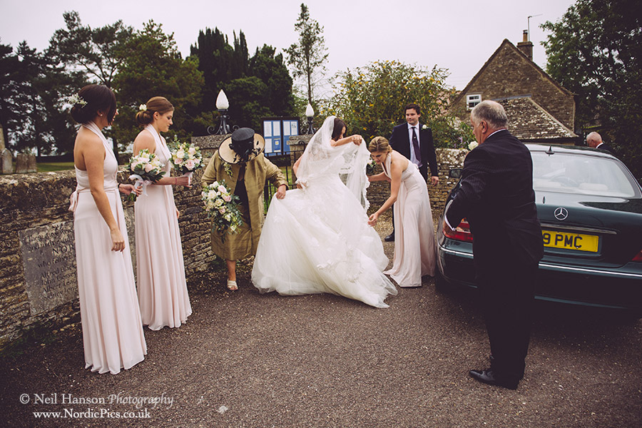 Bride arrives by car at North Leigh Church for her Wedding ceremony
