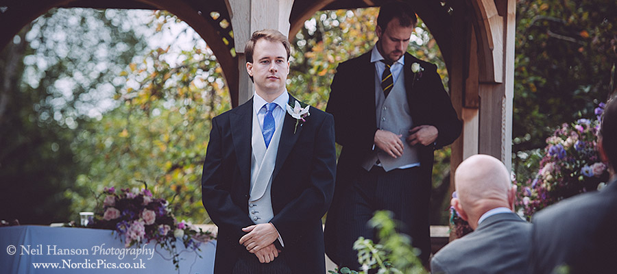 Groom waiting for his bride to arrive at an outdoor Wedding at Worton Park