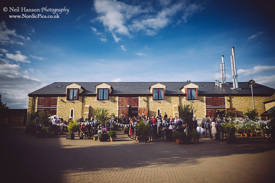 Drinks reception outside the main barn at Worton Park
