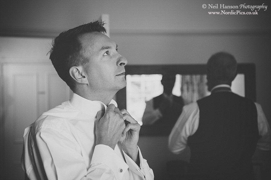 Groom preparing for his wedding at Caswell House in Oxfordshire