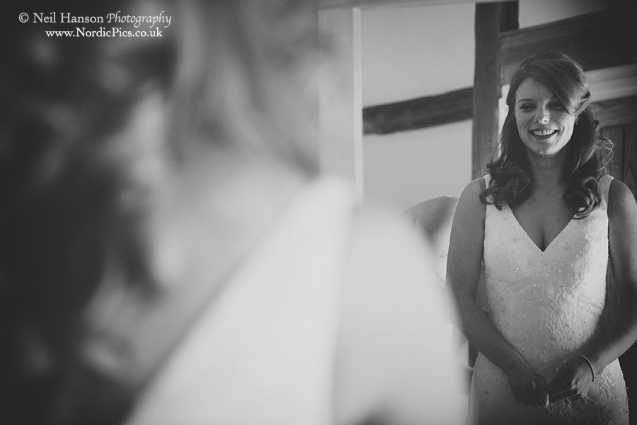 Bride putting on her wedding dress before a Caswell House Wedding ceremony