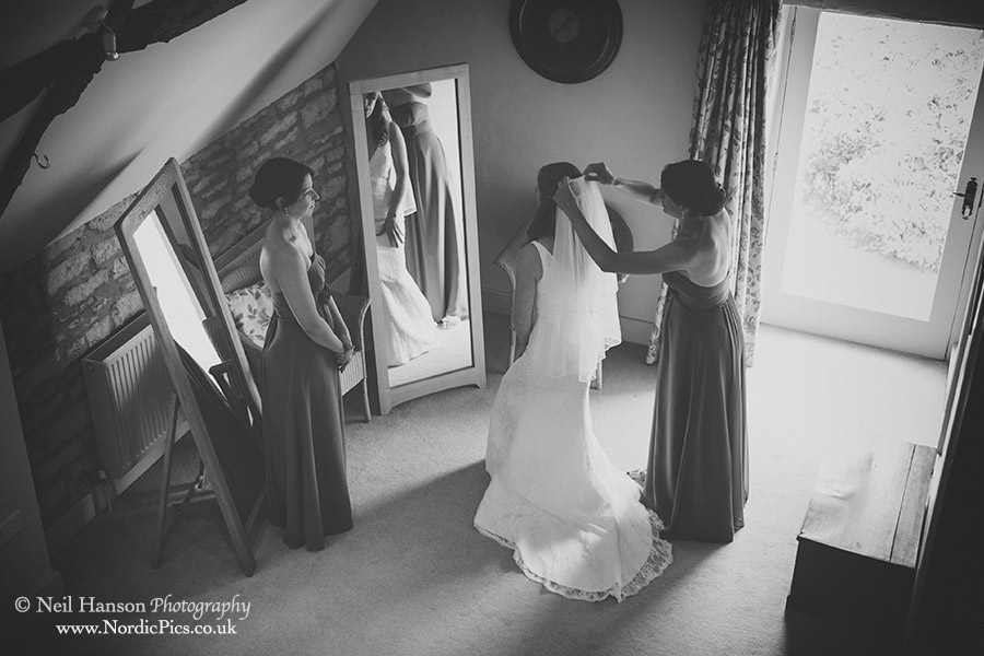 Bridesmaids attending to the brides veil