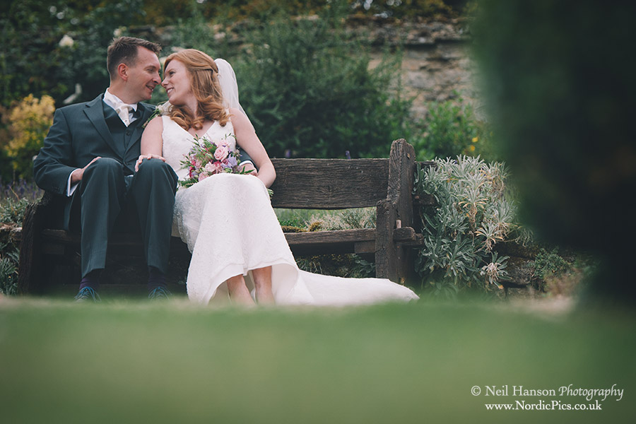Bride & groom in the gardens of Caswell House