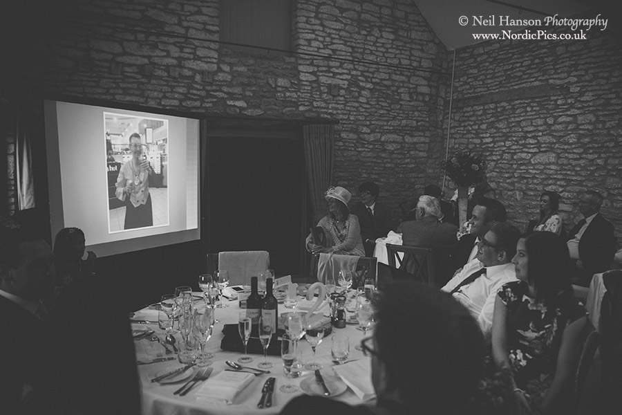 Embarrassing photos of the groom during the speeches at Caswell House