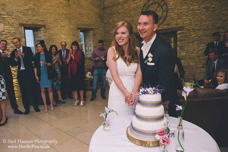 Bride & Groom cut their cake at a Caswell House Wedding