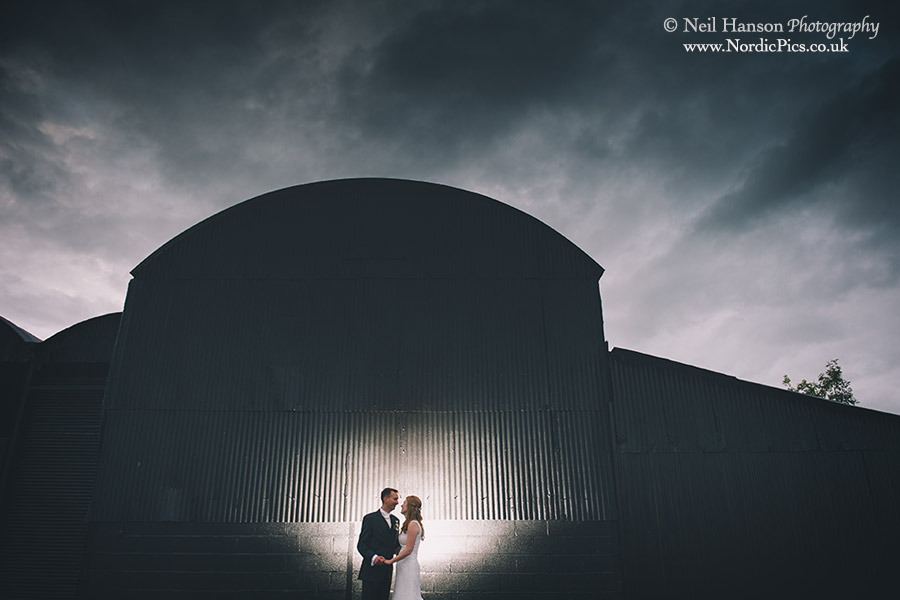 Creative nightime wedding portraits by neil hanson at Caswell House