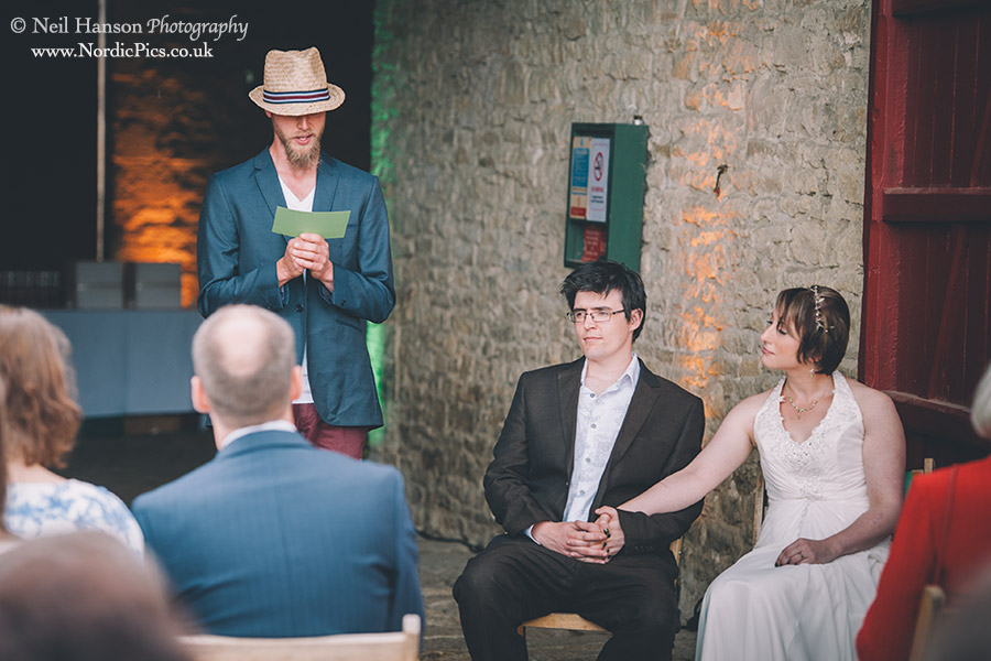 Guest making a reading at a Cogges Wedding ceremony