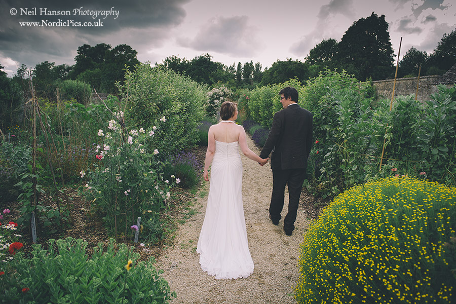 Bride & Groom walking in the gardens of Cogges Farm Museum