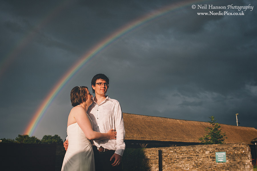Bride Groom & rainbow at Cogges Farm