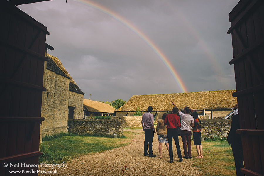Guests point toward a rainbow at Cogges Witney