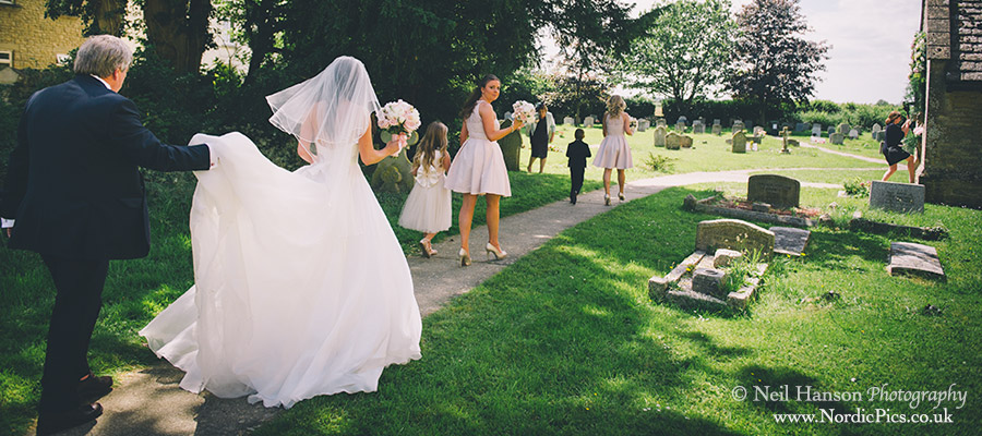 Bridal party walks to church before the ceremony