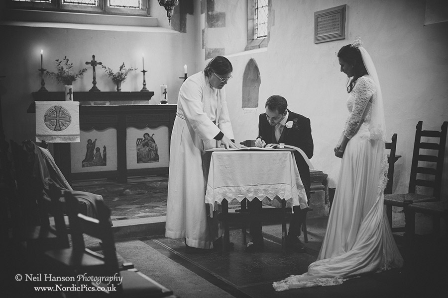 Signing the register at a Blewbury Church Wedding