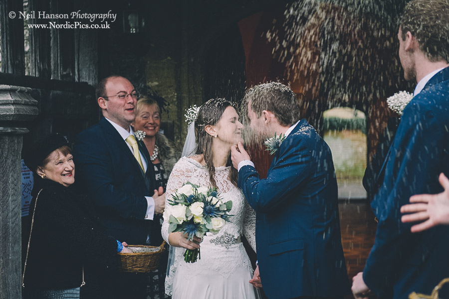 Confetti being thrown by guests at a Blewbury Church Wedding