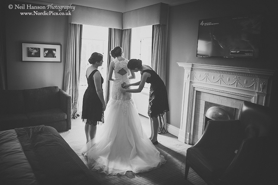 Bride putting on her Wedding dress at Milton Hill House Venue