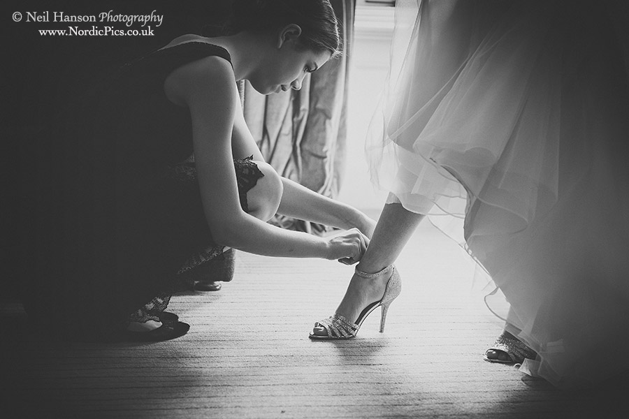 Wedding shoes being put on 