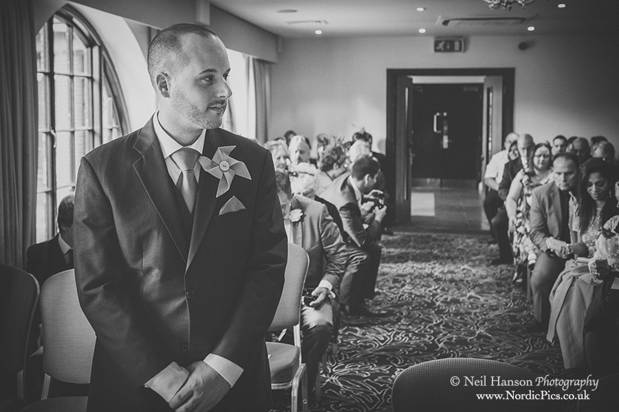 Groom waiting in the ceremony room for his bride at a Milton Hill House Wedding