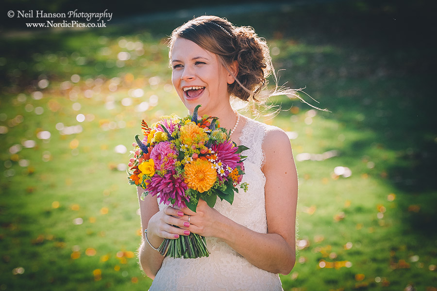 Bride laughing on her wedding day at Milton Hill House