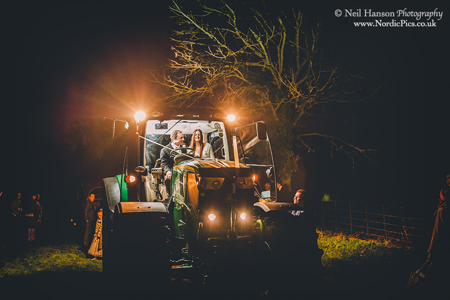 Bride & groom driving a John Deer Tractor