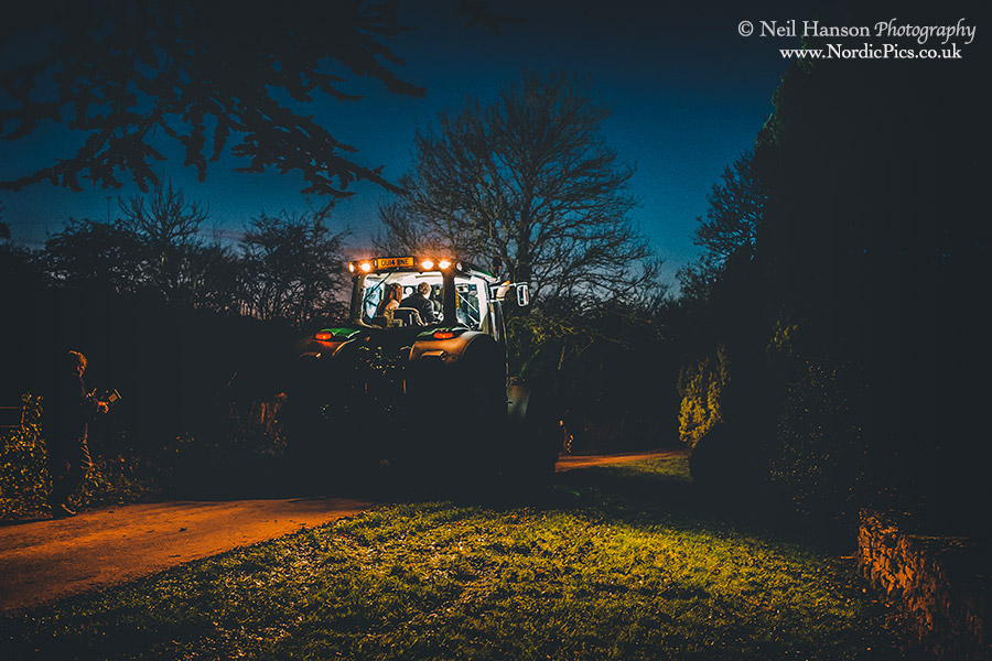 Bride & groom leave for their wedding reception in a John Deer Tractor